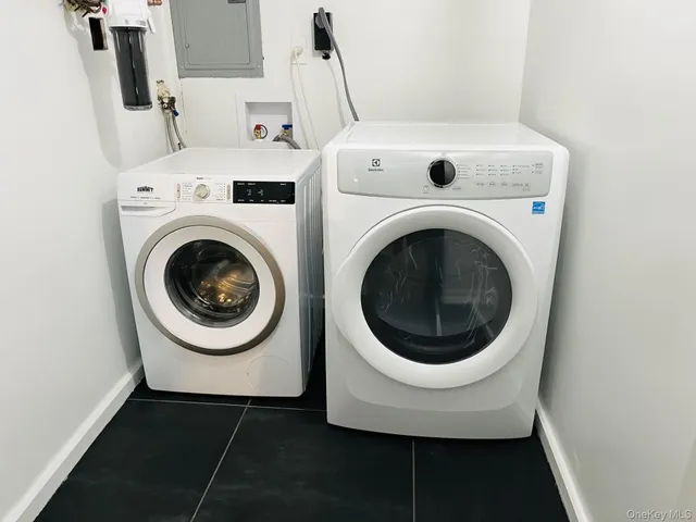 a utility room with dryer and washer