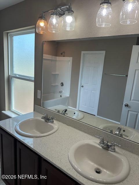 9670 Freefall Road Jacksonville, FL 32221 - Photo 19 of 31 a bathroom with a sink and a mirror