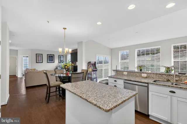 a kitchen with a table and chairs in it