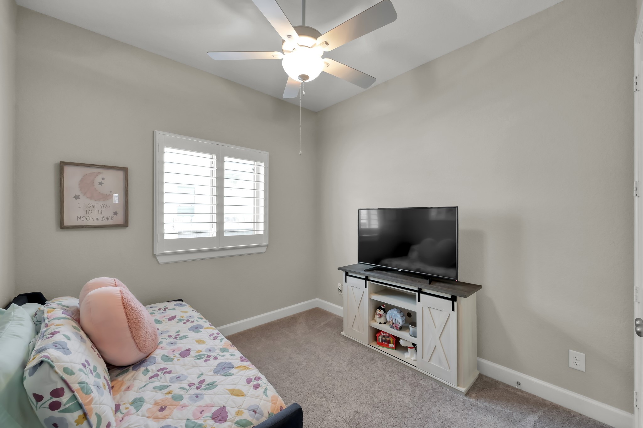 334 Torrey Bloom Loop Conroe, TX 77304 - Photo 33 of 47 Comfortable secondary bedroom with soft natural light, neutral tones, and flexible space for guests or everyday living.