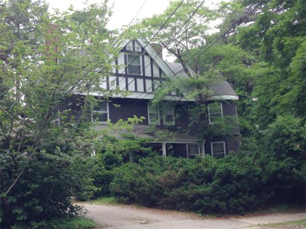 36 Sumner Road Brookline, MA 02445 - Photo 2 of 2 a front view of a house with a yard and trees