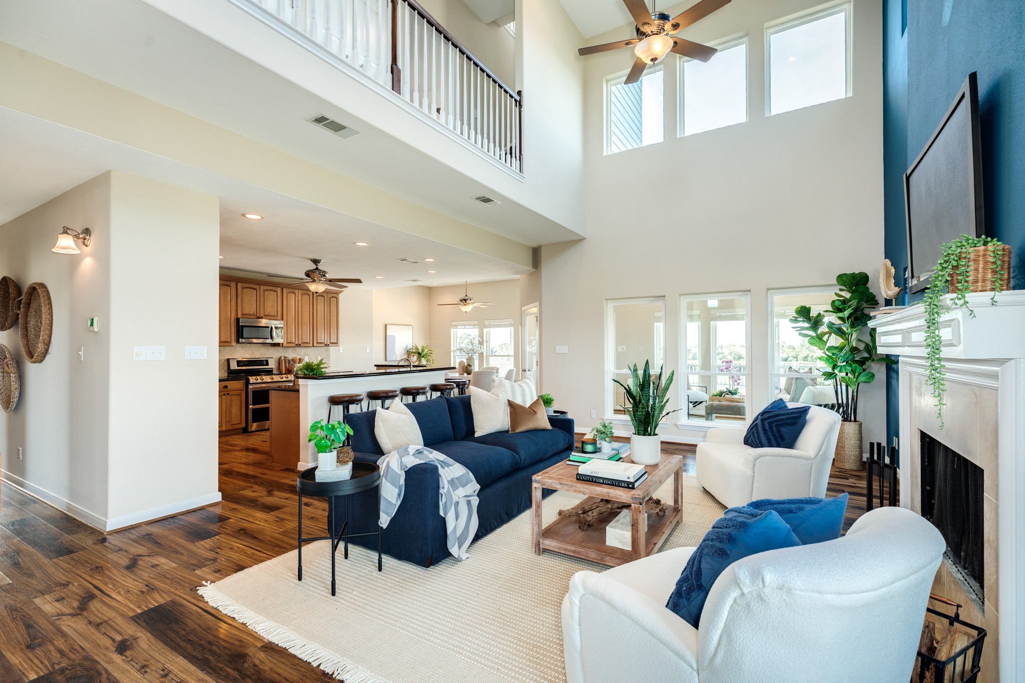 11648 Zingelmann Road Galveston, TX 77554 - Photo 11 of 39 a living room with furniture and a flat screen tv