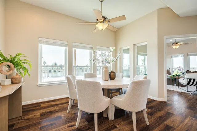 a view of a dining room with furniture window and wooden floor