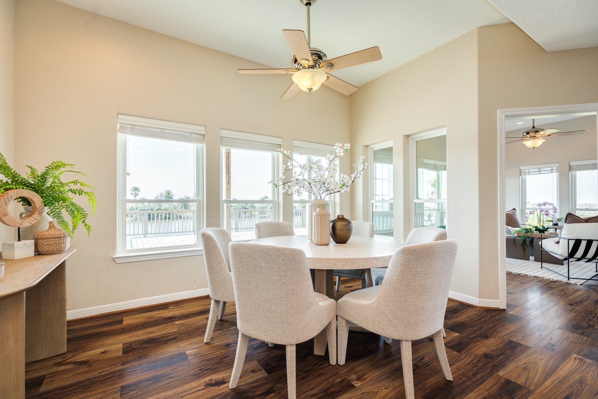 11648 Zingelmann Road Galveston, TX 77554 - Photo 17 of 39 a view of a dining room with furniture window and wooden floor