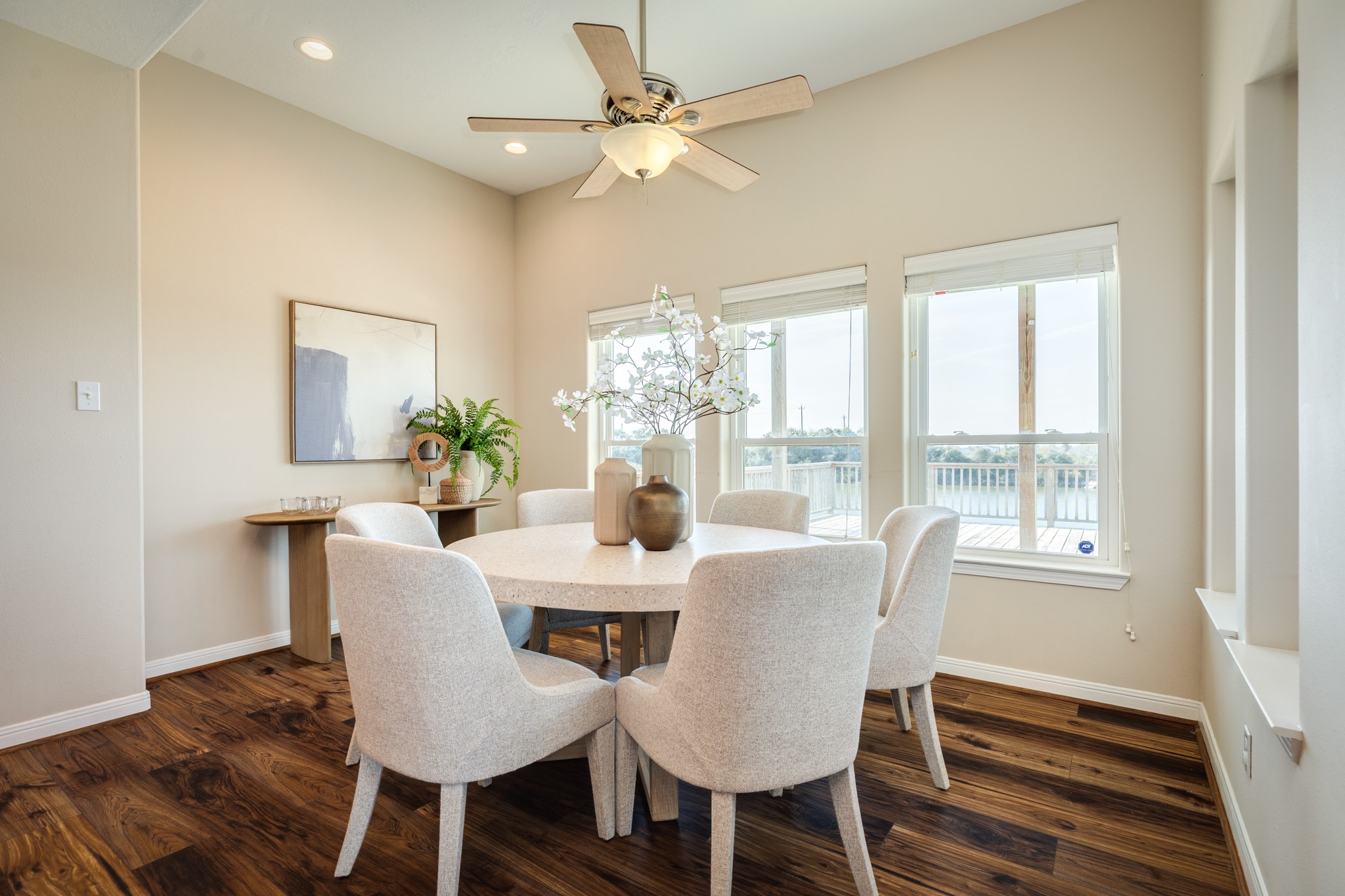 11648 Zingelmann Road Galveston, TX 77554 - Photo 18 of 39 a view of a dining room with furniture window and wooden floor
