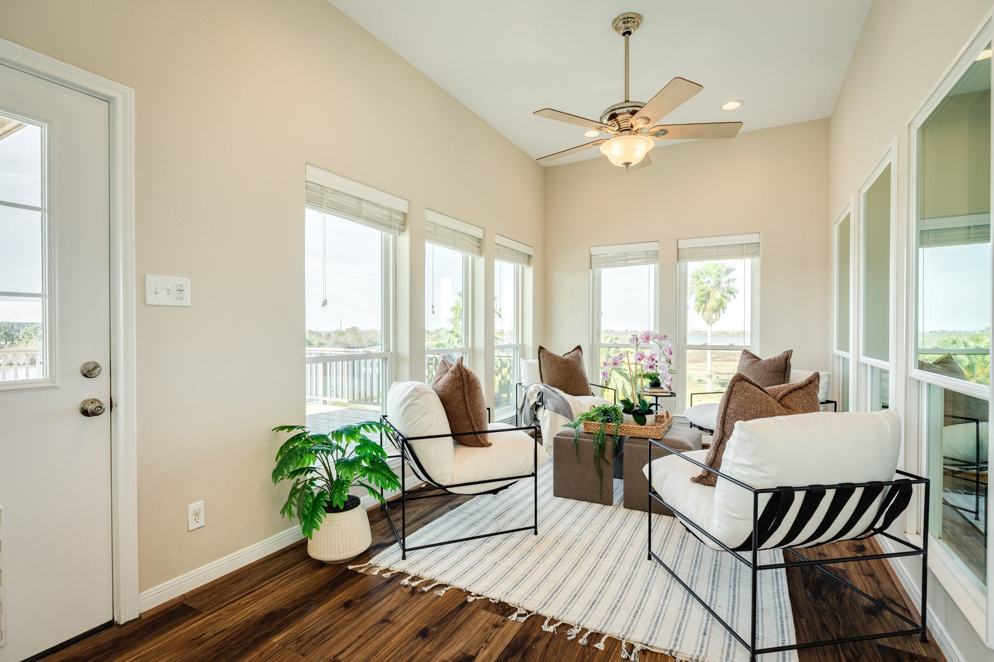 11648 Zingelmann Road Galveston, TX 77554 - Photo 19 of 39 a living room with furniture and a large window