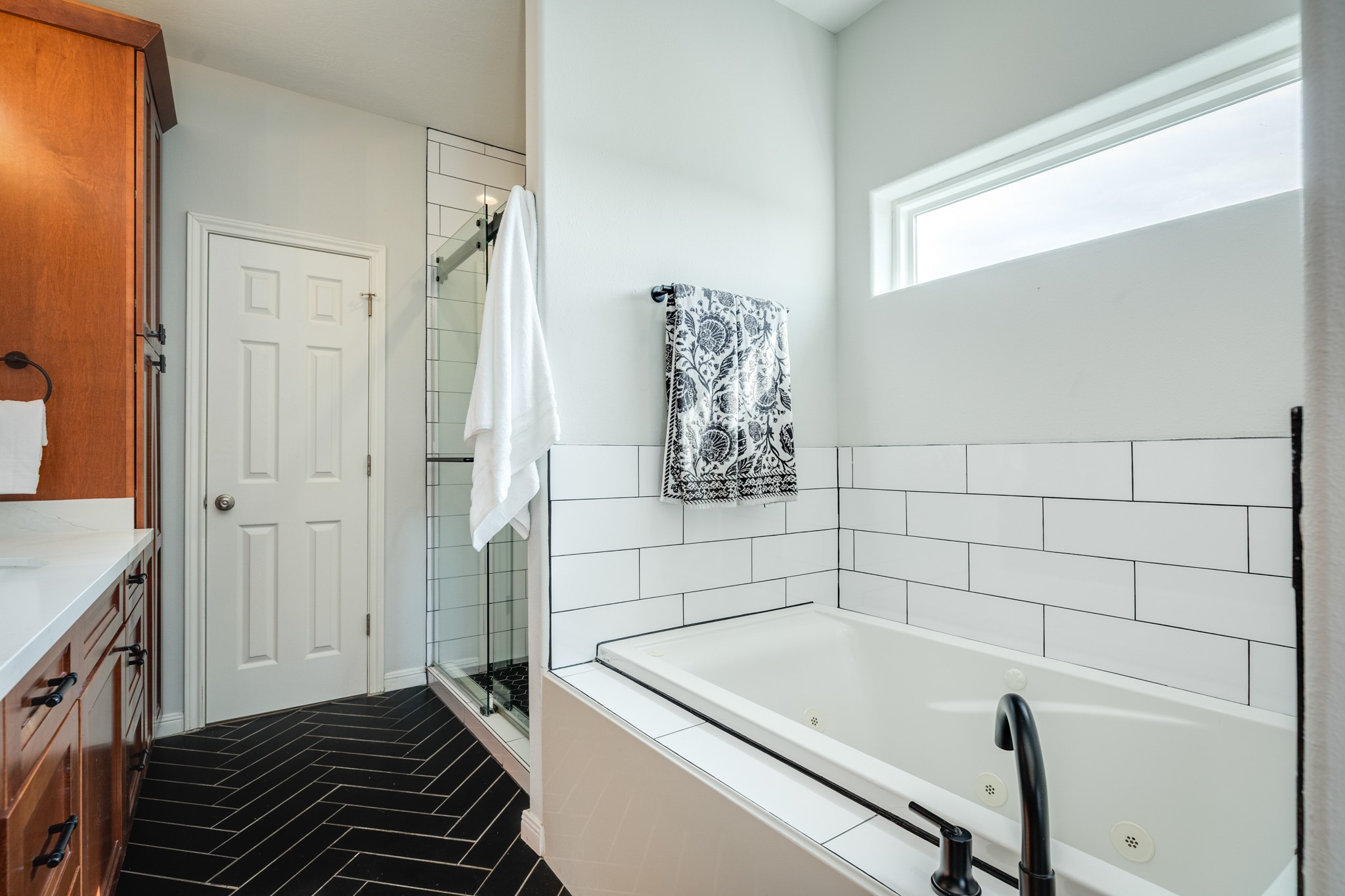 11648 Zingelmann Road Galveston, TX 77554 - Photo 23 of 39 a bathroom with a bathtub and shower