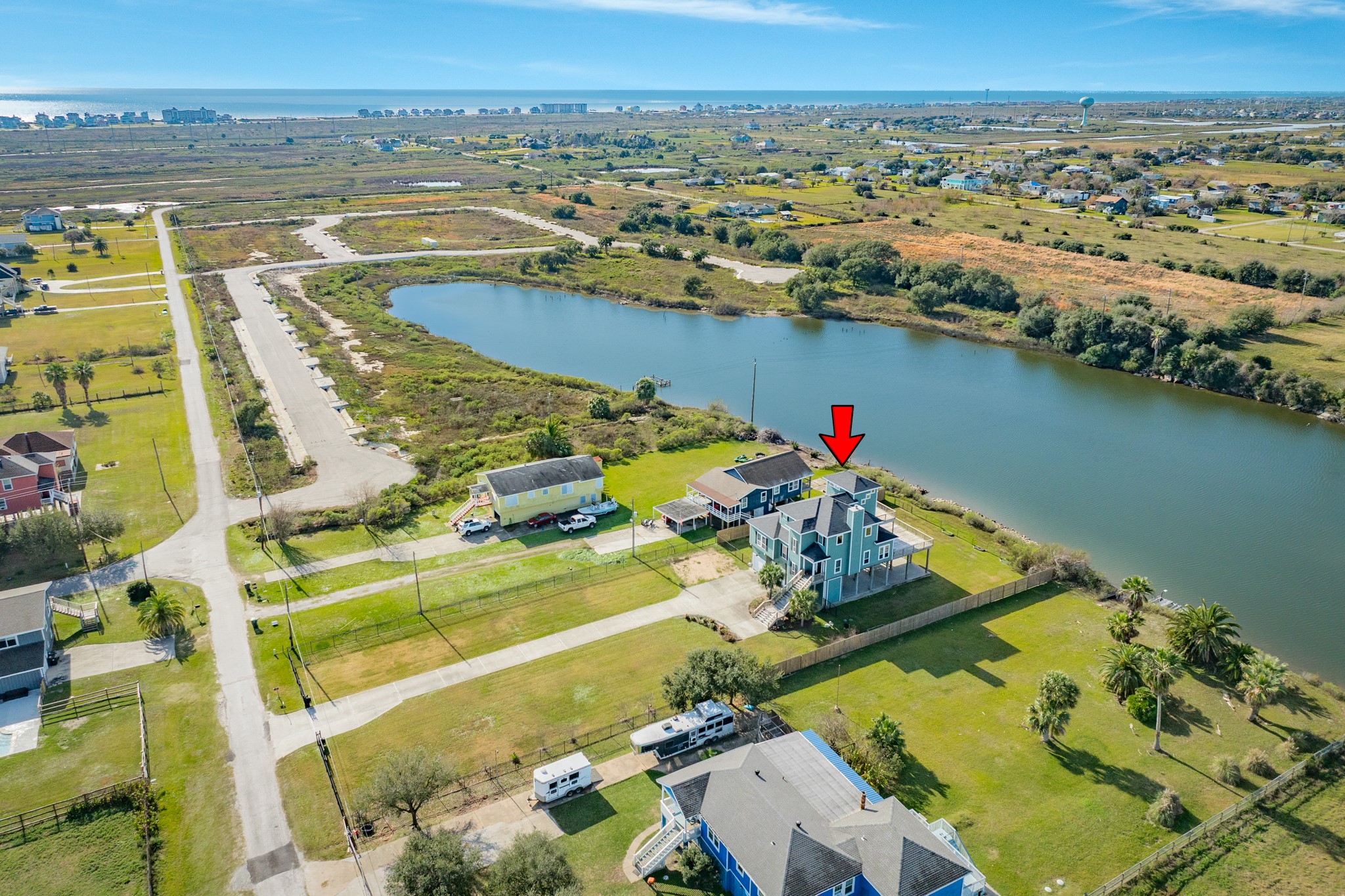 11648 Zingelmann Road Galveston, TX 77554 - Photo 6 of 39 an aerial view of a house with a lake view