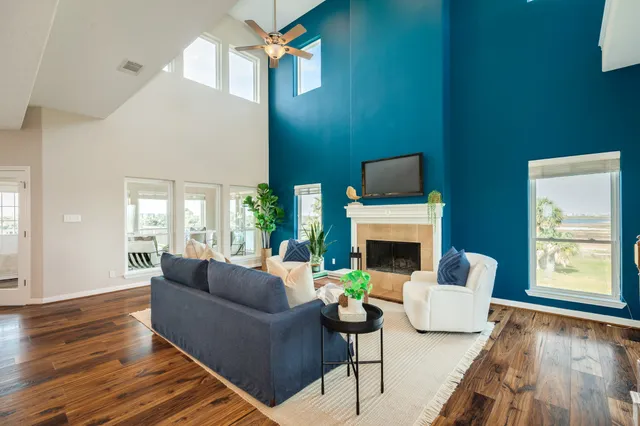 a living room with furniture and a fireplace