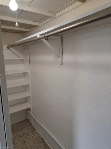 a view of an empty walk in closet