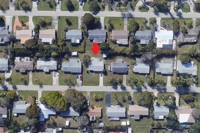 an aerial view of houses with outdoor space