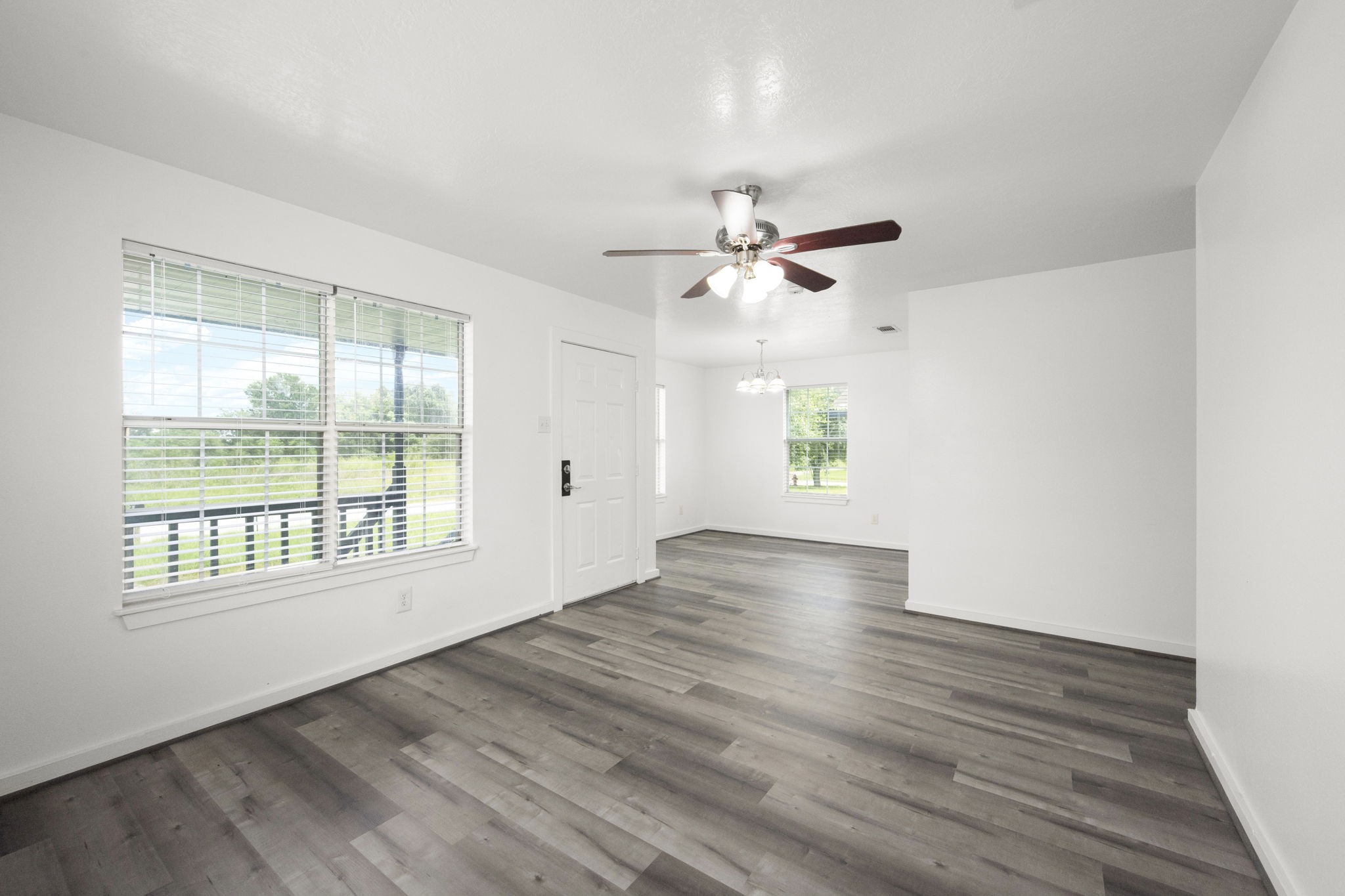 1935 1st Street Hempstead, TX 77445 - Photo 15 of 29 wooden floor in an empty room with a window