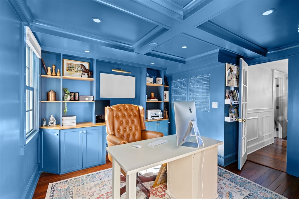 54 Elm Street Hingham, MA 02043 - Photo 14 of 33 a living room with a couch and a bookshelf