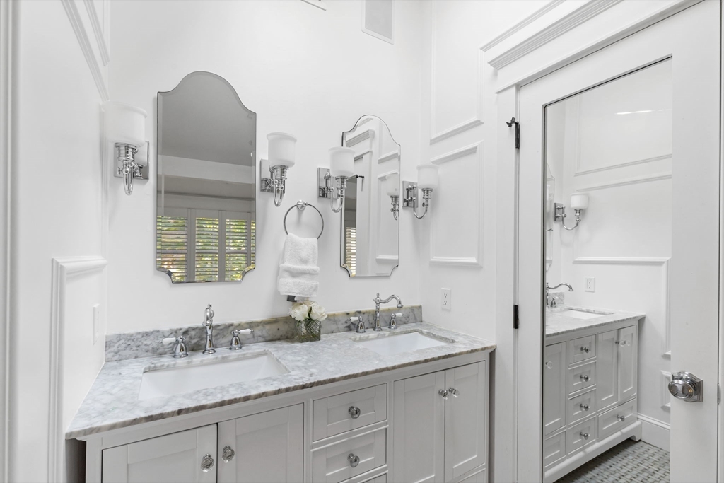 54 Elm Street Hingham, MA 02043 - Photo 19 of 33 a bathroom with a granite countertop sink mirror and double
