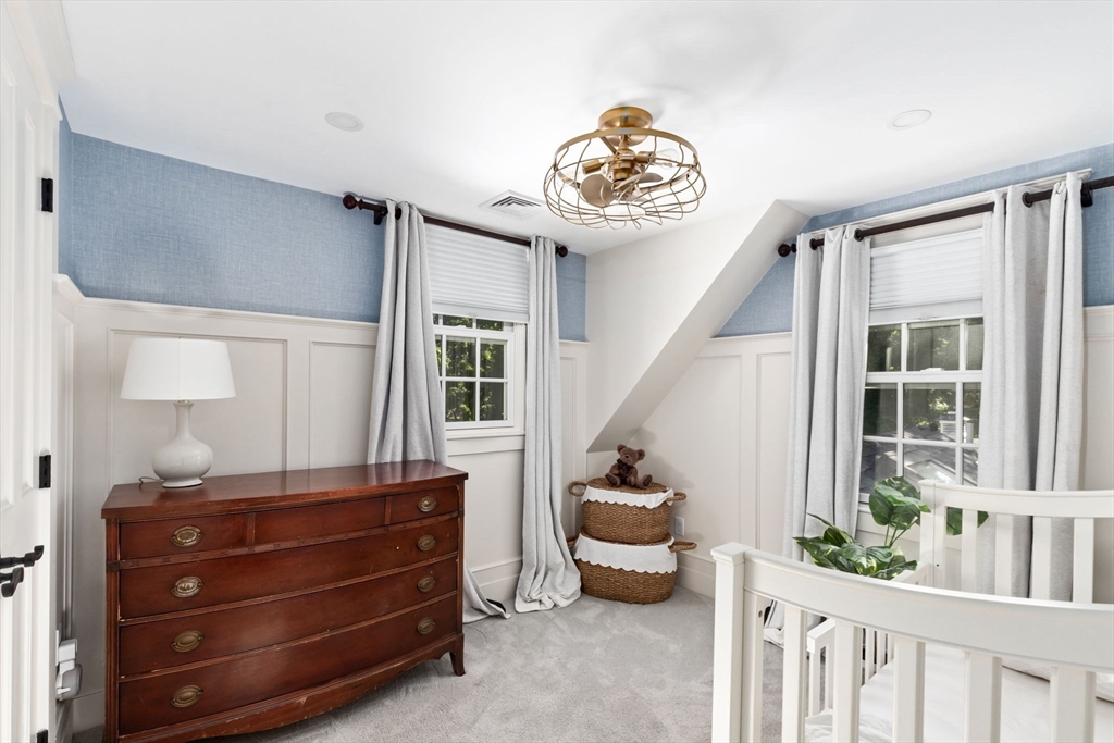 54 Elm Street Hingham, MA 02043 - Photo 21 of 33 a bedroom with furniture and a large window