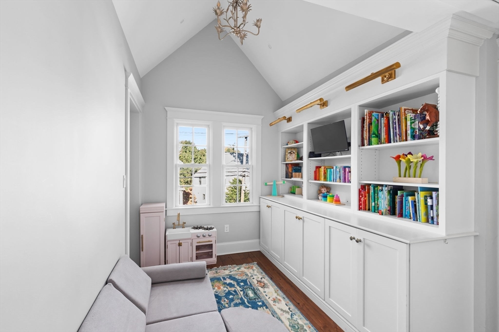 54 Elm Street Hingham, MA 02043 - Photo 24 of 33 a room with furniture a book shelf and a book shelf