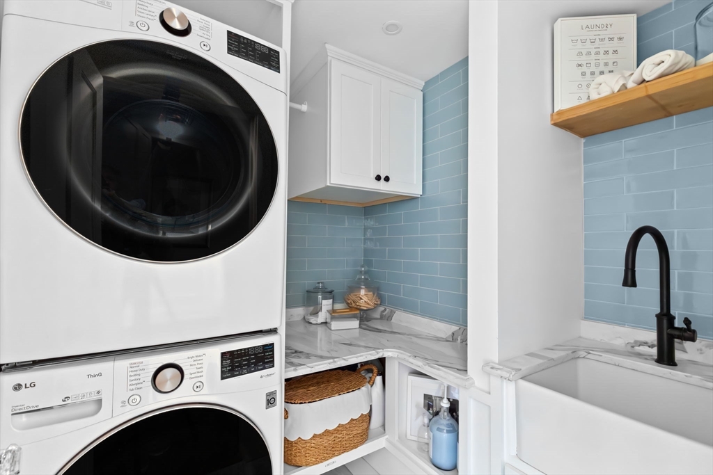 54 Elm Street Hingham, MA 02043 - Photo 25 of 33 a utility room with sink dryer and washer