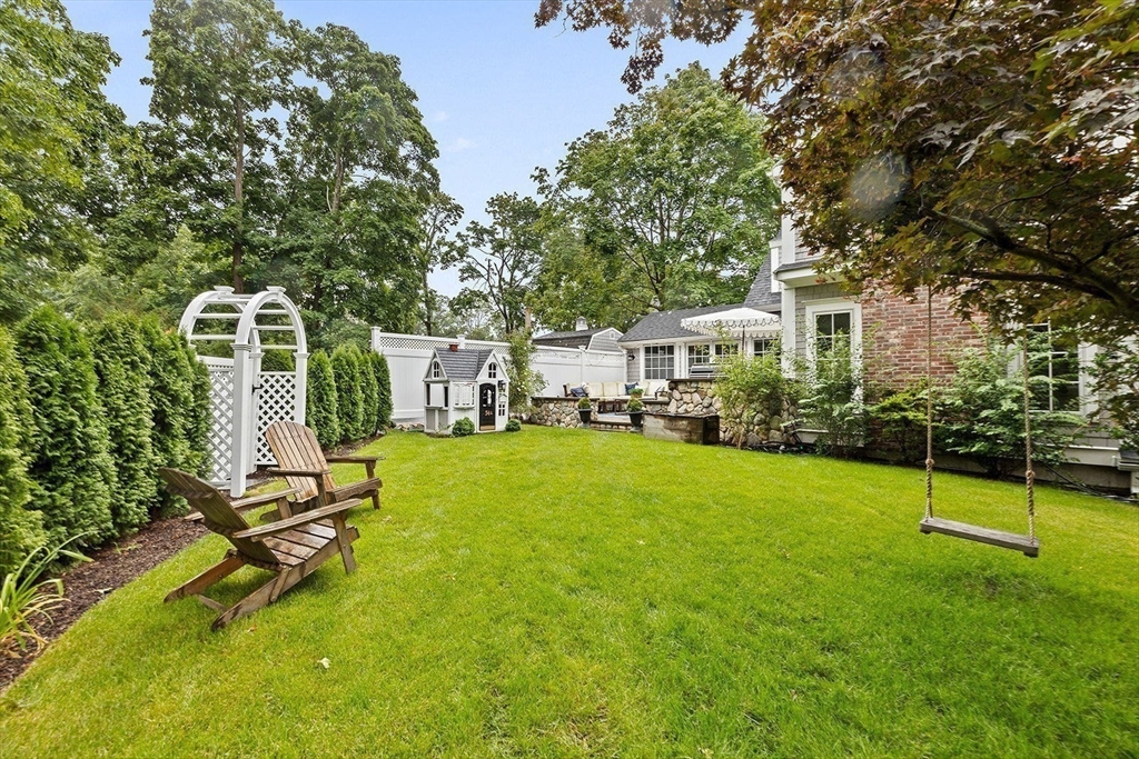 54 Elm Street Hingham, MA 02043 - Photo 29 of 33 a view of a house with a backyard and a tree