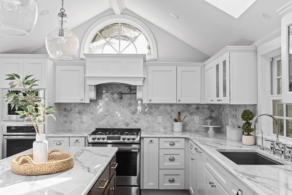 54 Elm Street Hingham, MA 02043 - Photo 3 of 33 a kitchen with a stove a sink and a stove