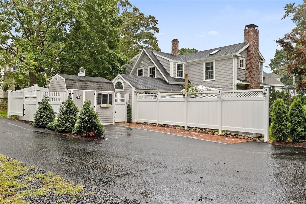 54 Elm Street Hingham, MA 02043 - Photo 33 of 33 a front view of a house with a yard