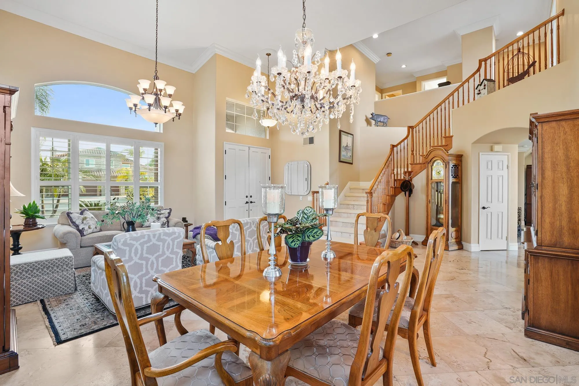 5028 Avenida De La Plata Oceanside, CA 92057 - Photo 13 of 68 a view of a dining room with furniture a chandelier and large windows