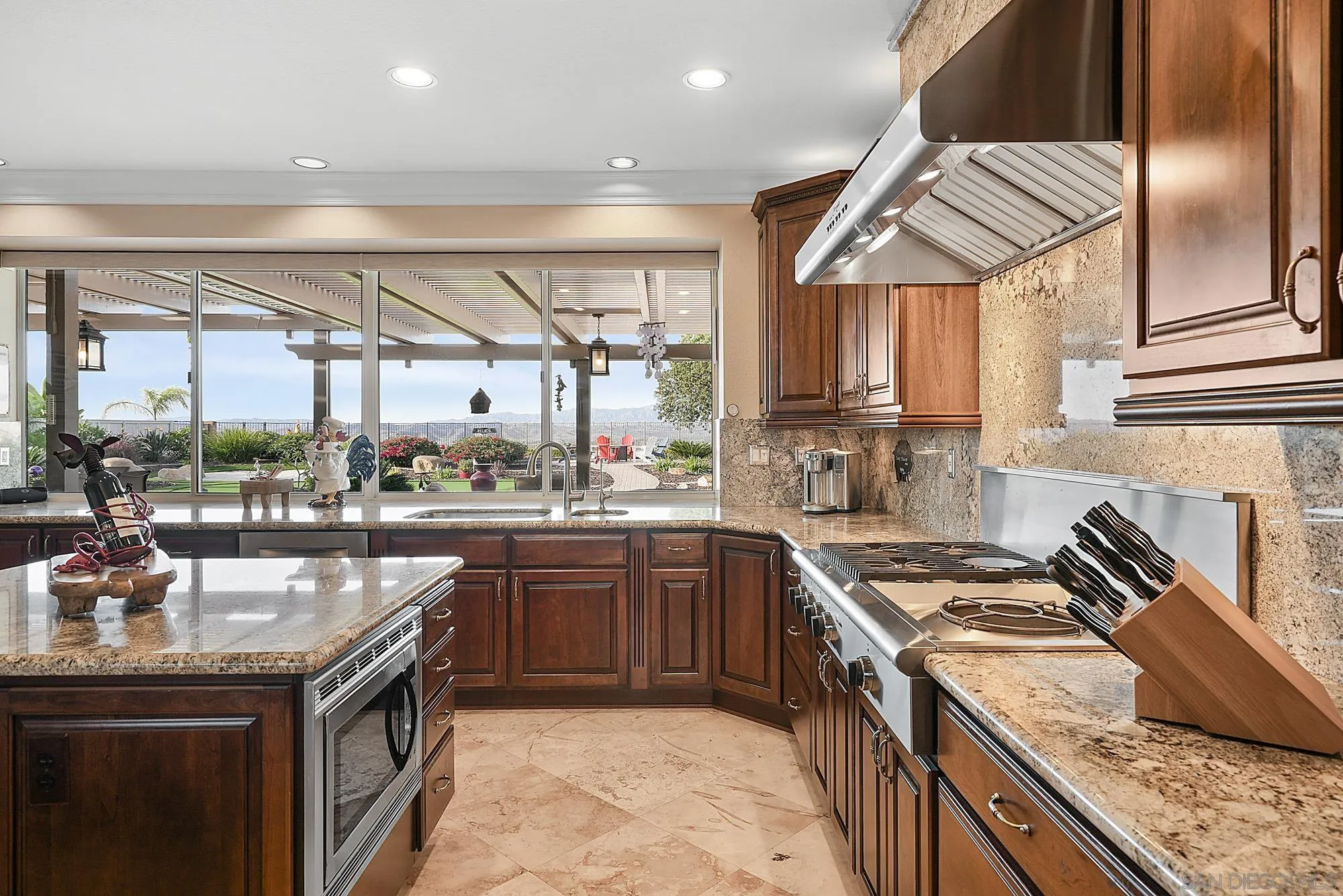 5028 Avenida De La Plata Oceanside, CA 92057 - Photo 14 of 68 a kitchen with a sink stove and cabinets