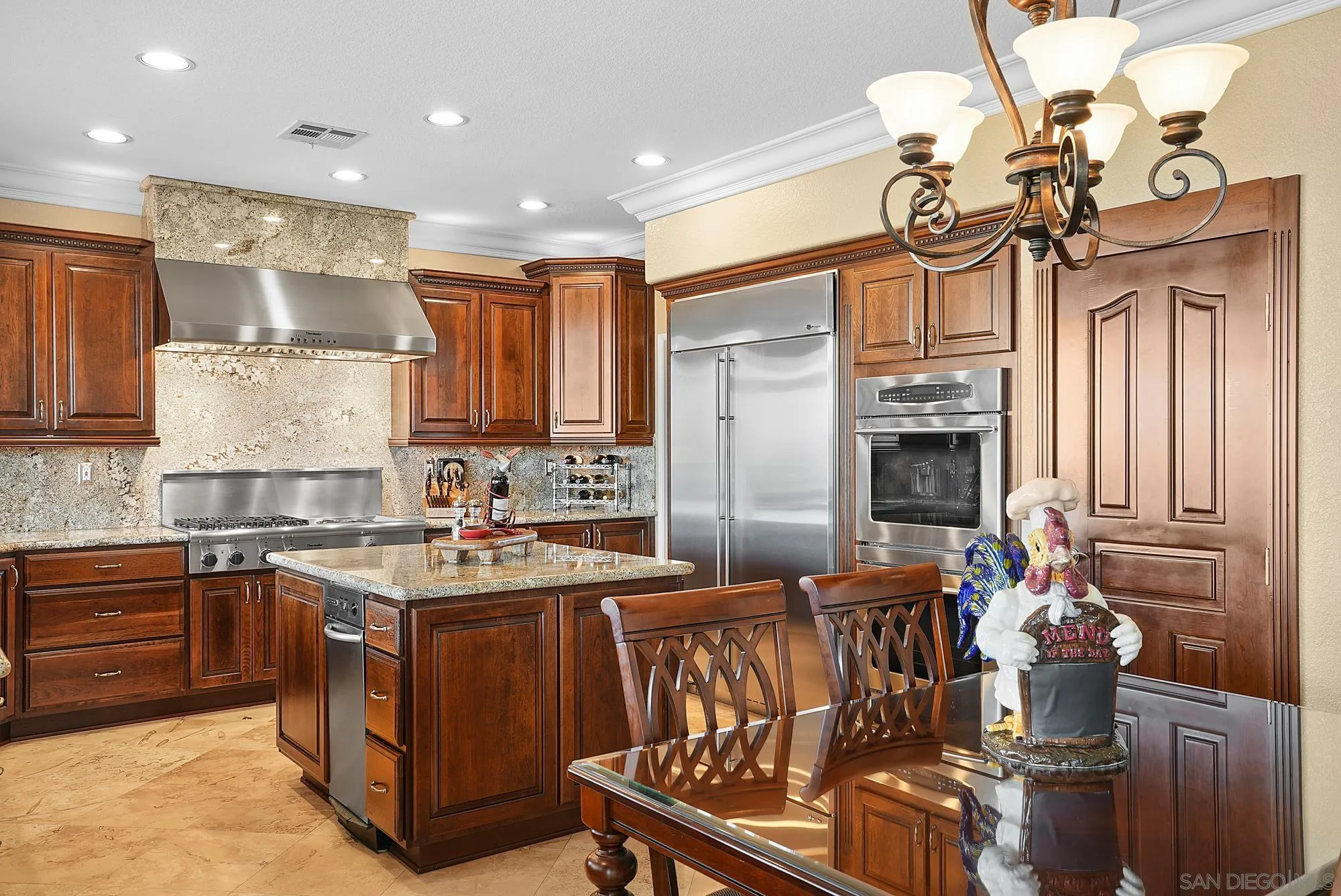 5028 Avenida De La Plata Oceanside, CA 92057 - Photo 17 of 68 a kitchen with stainless steel appliances a sink a stove a refrigerator cabinets and living room view
