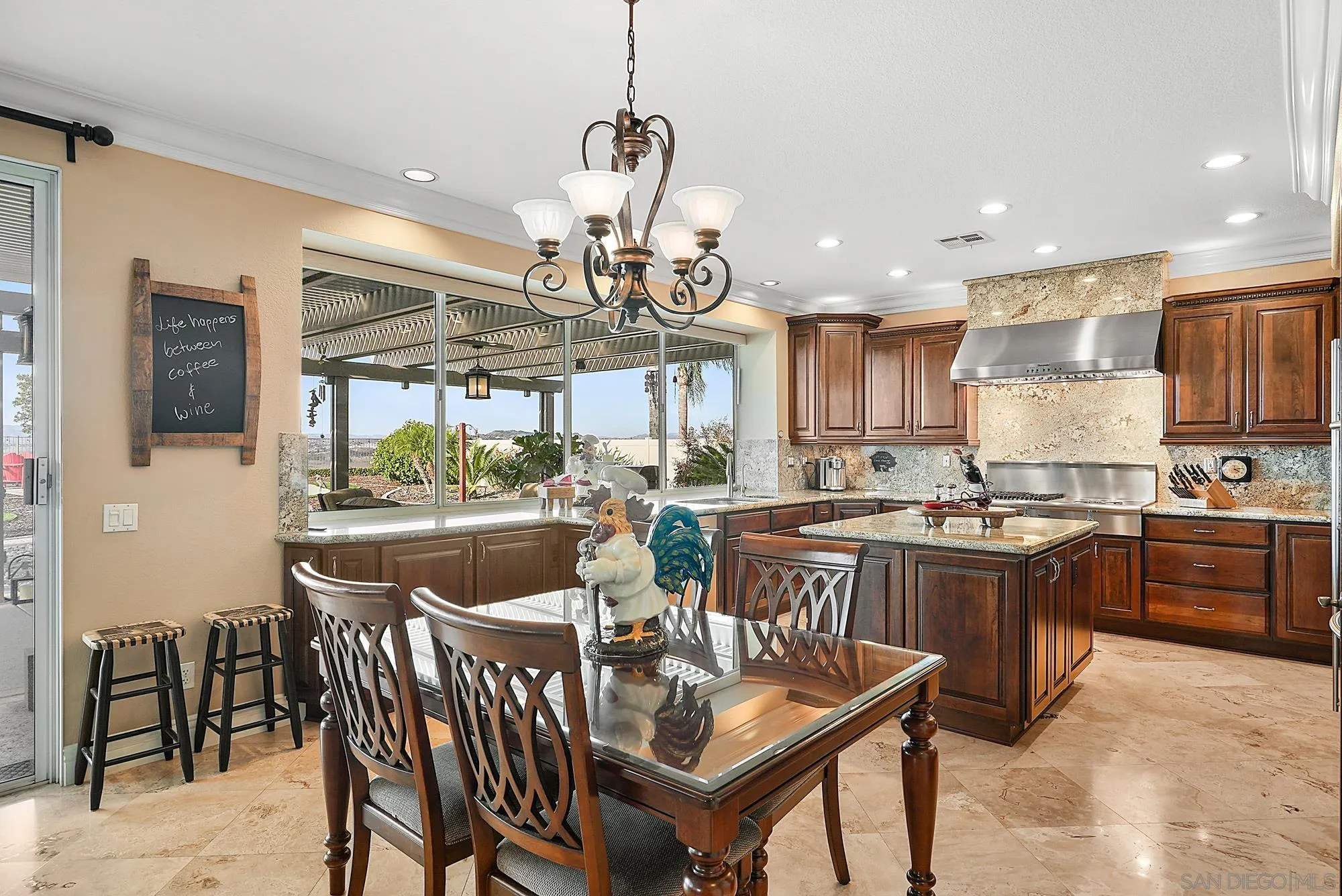 5028 Avenida De La Plata Oceanside, CA 92057 - Photo 19 of 68 a view of a dining room and livingroom with furniture wooden floor a chandelier