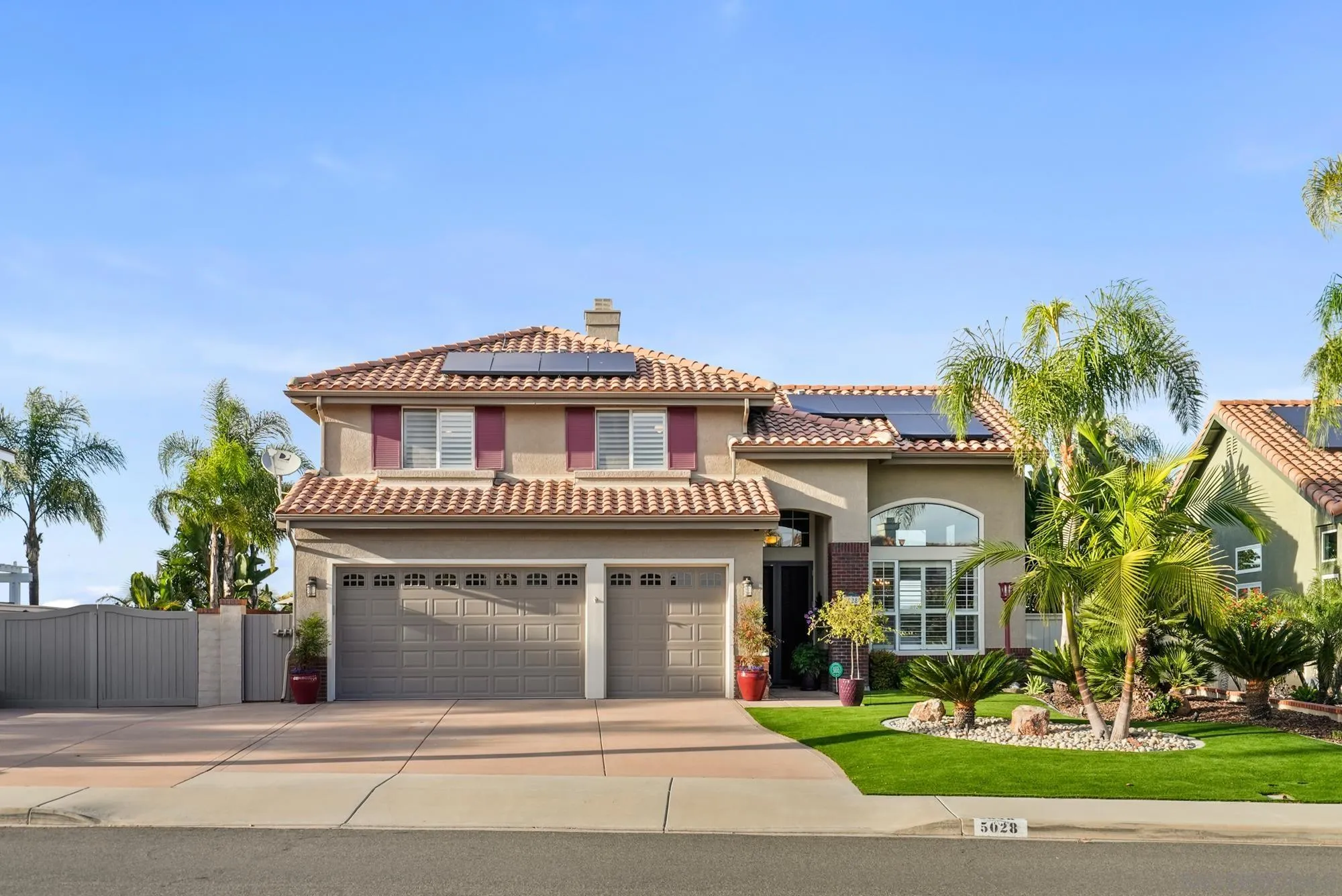 5028 Avenida De La Plata Oceanside, CA 92057 - Photo 2 of 68 a front view of a house with a yard