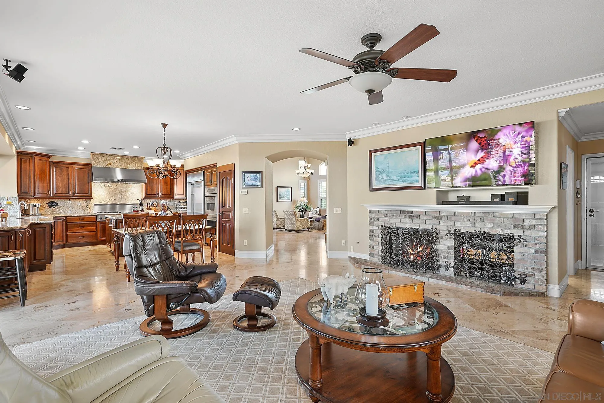 5028 Avenida De La Plata Oceanside, CA 92057 - Photo 22 of 68 a living room with furniture a fireplace and a flat screen tv