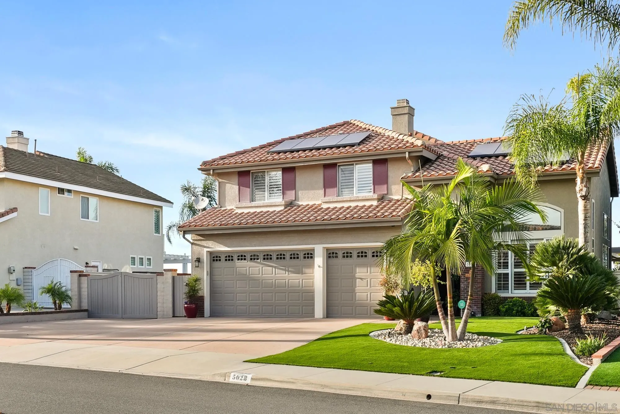 5028 Avenida De La Plata Oceanside, CA 92057 - Photo 3 of 68 a front view of a house with a yard and potted plants