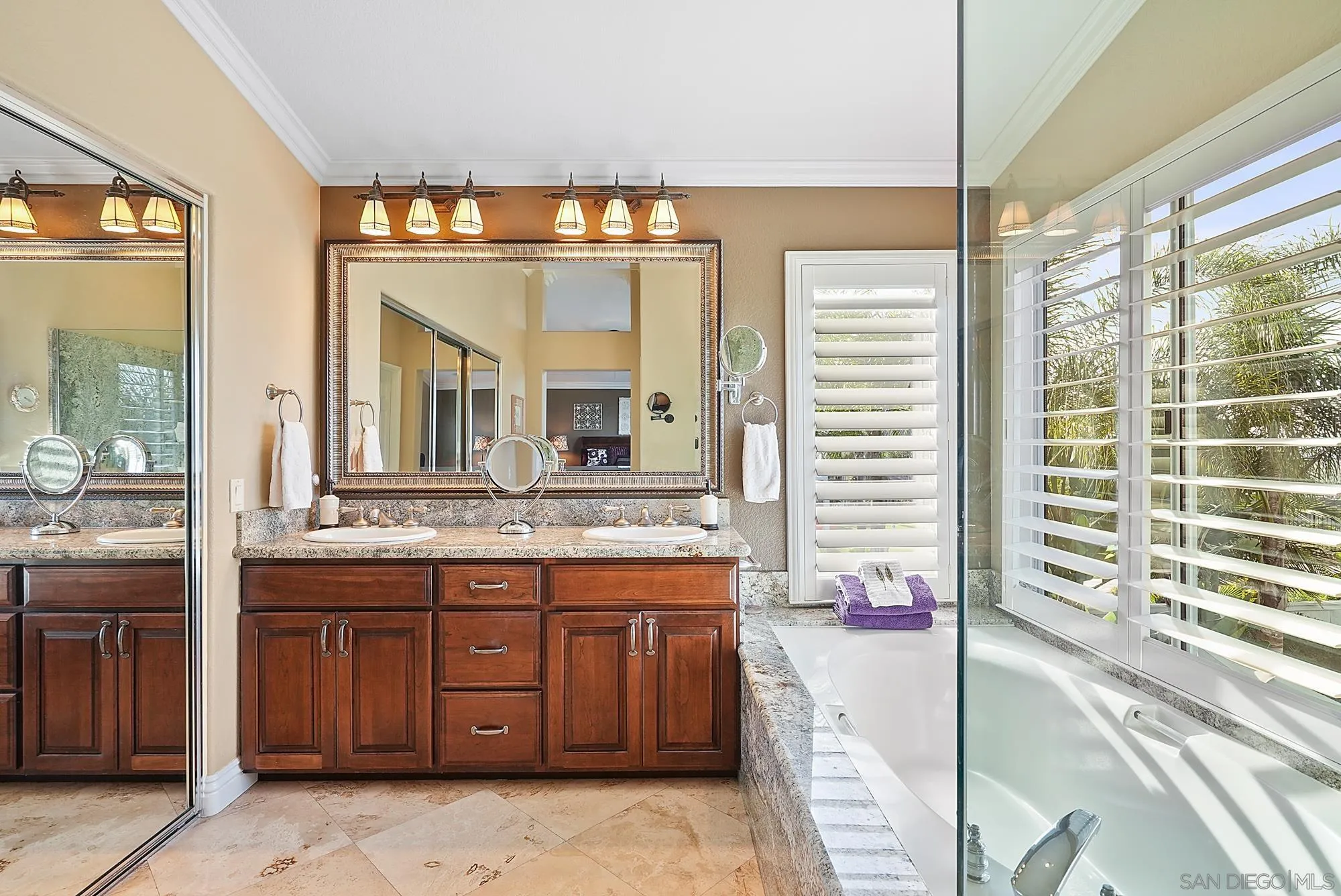 5028 Avenida De La Plata Oceanside, CA 92057 - Photo 31 of 68 a bathroom with a granite countertop sink and a large mirror