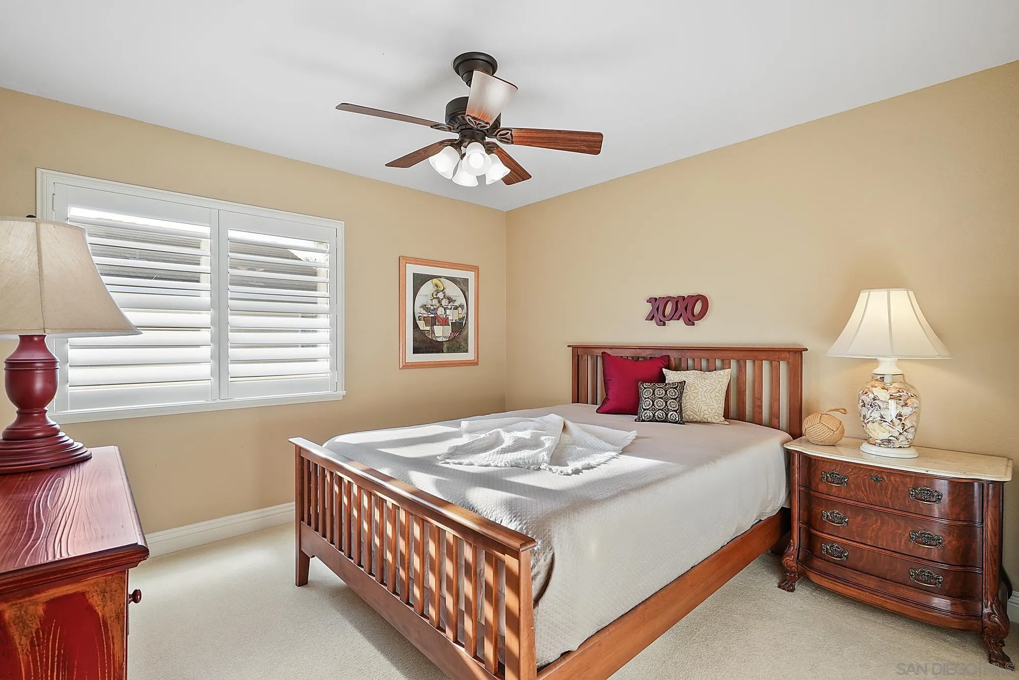 5028 Avenida De La Plata Oceanside, CA 92057 - Photo 38 of 68 a bedroom with a bed and a chandelier