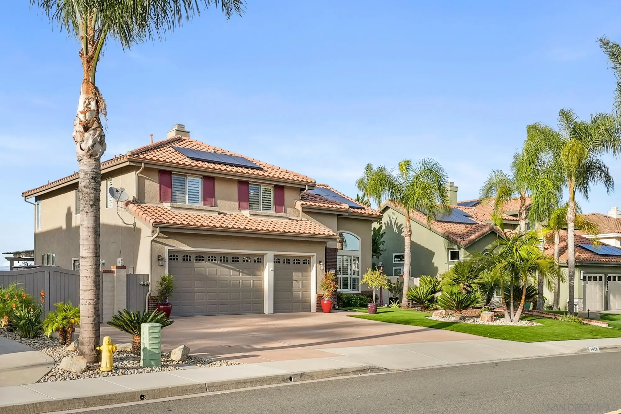 5028 Avenida De La Plata Oceanside, CA 92057 - Photo 4 of 68 a front view of a house with a garden