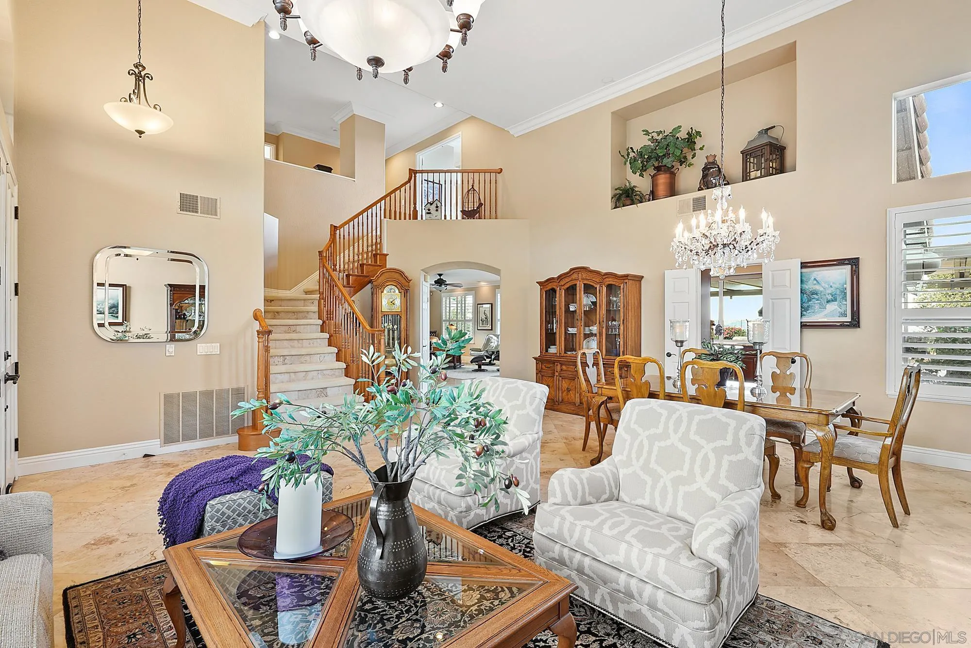 5028 Avenida De La Plata Oceanside, CA 92057 - Photo 9 of 68 a living room with furniture and a chandelier