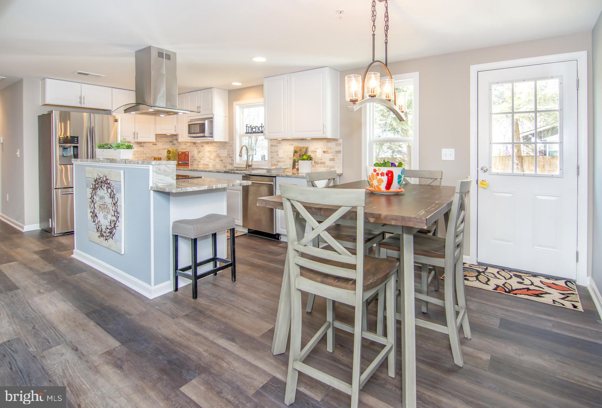101 Concord Road Chestertown, MD 21620 - Photo 5 of 38 Kitchen with chimney hood and island w/bbar