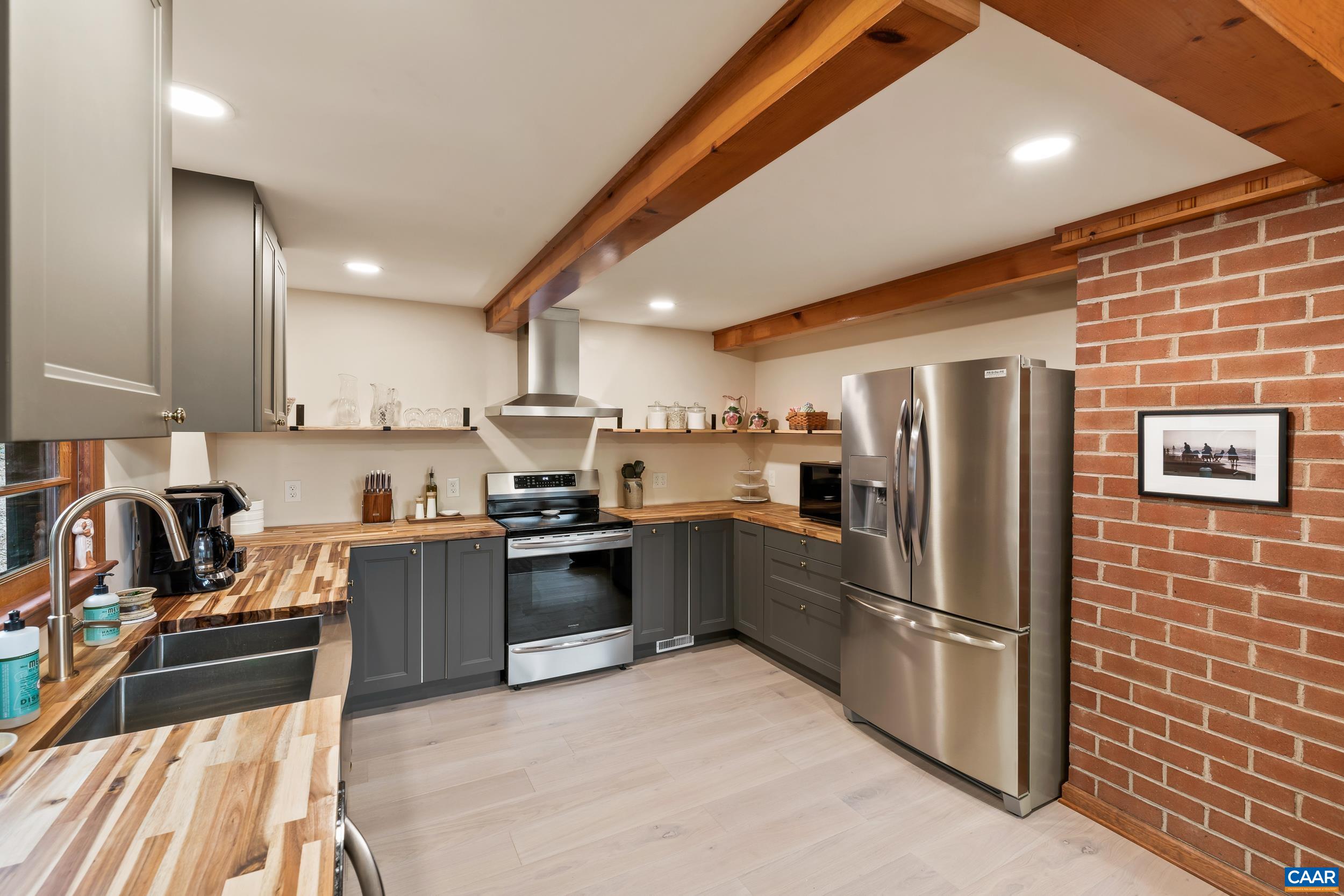 4496 Weakley Hollow Road Syria, VA 22743 - Photo 12 of 37 a kitchen with granite countertop stainless steel appliances and wooden cabinets