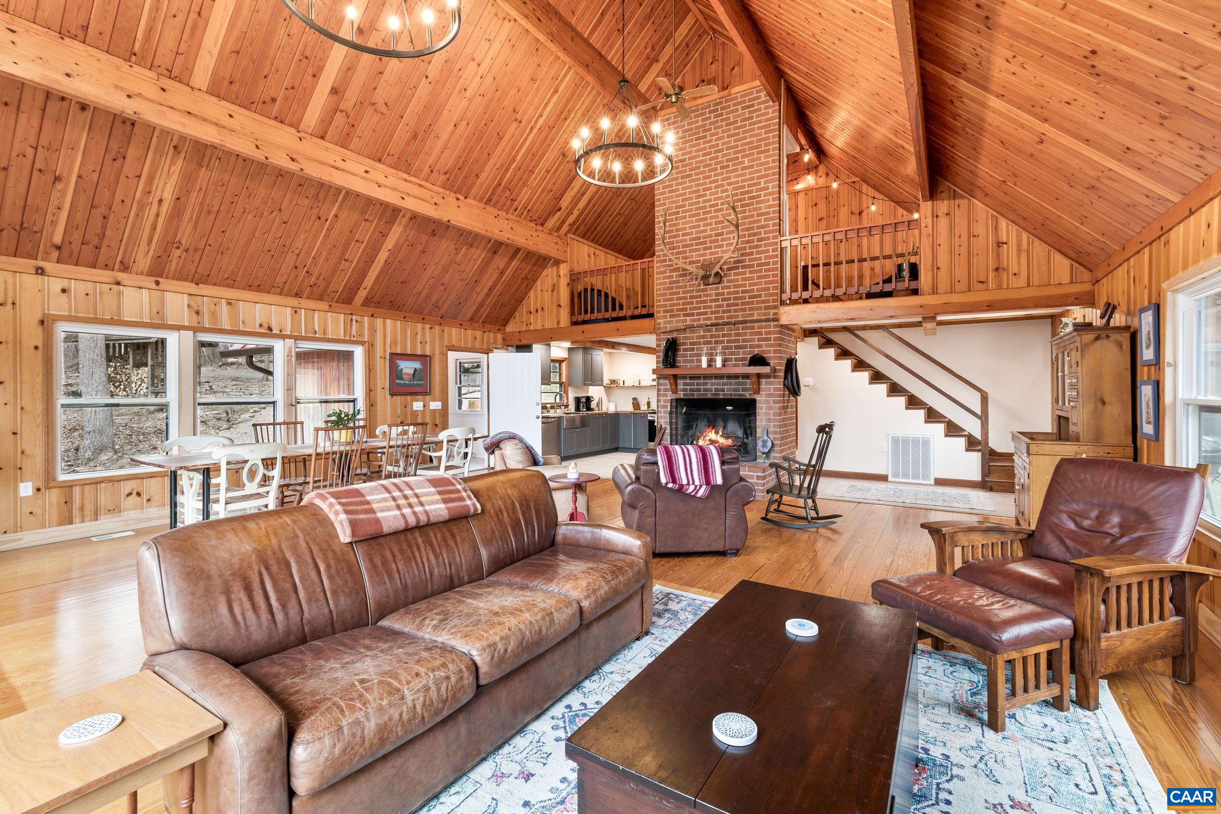4496 Weakley Hollow Road Syria, VA 22743 - Photo 20 of 37 a roof deck with couches and potted plants