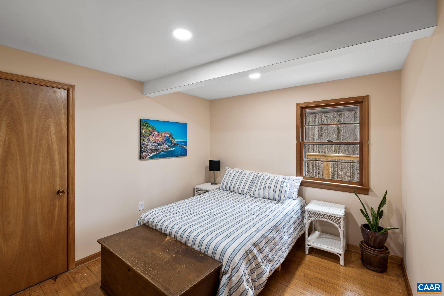 4496 Weakley Hollow Road Syria, VA 22743 - Photo 22 of 37 a bedroom with a bed and a window