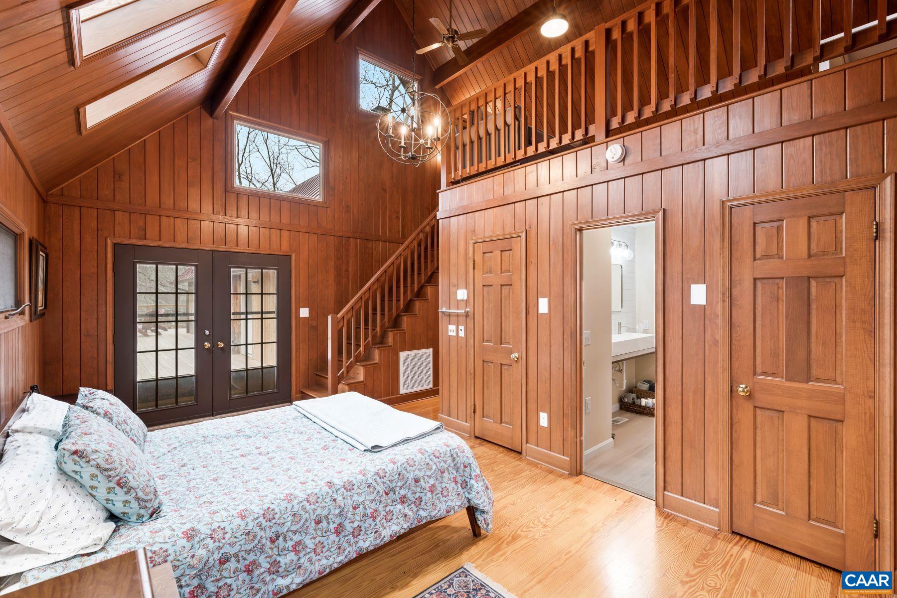 4496 Weakley Hollow Road Syria, VA 22743 - Photo 26 of 37 a bedroom with a bed and a window