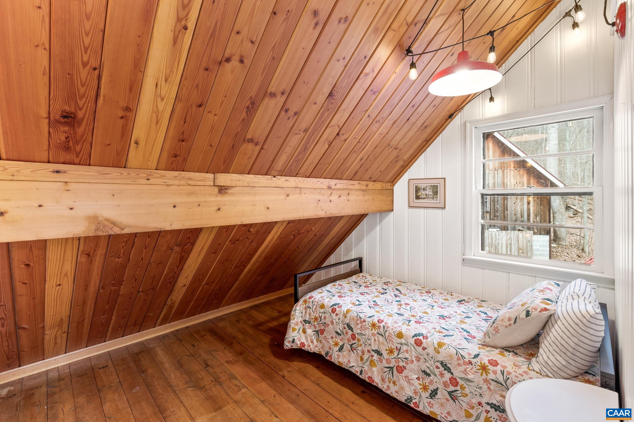 4496 Weakley Hollow Road Syria, VA 22743 - Photo 32 of 37 a bedroom with a bed and a window