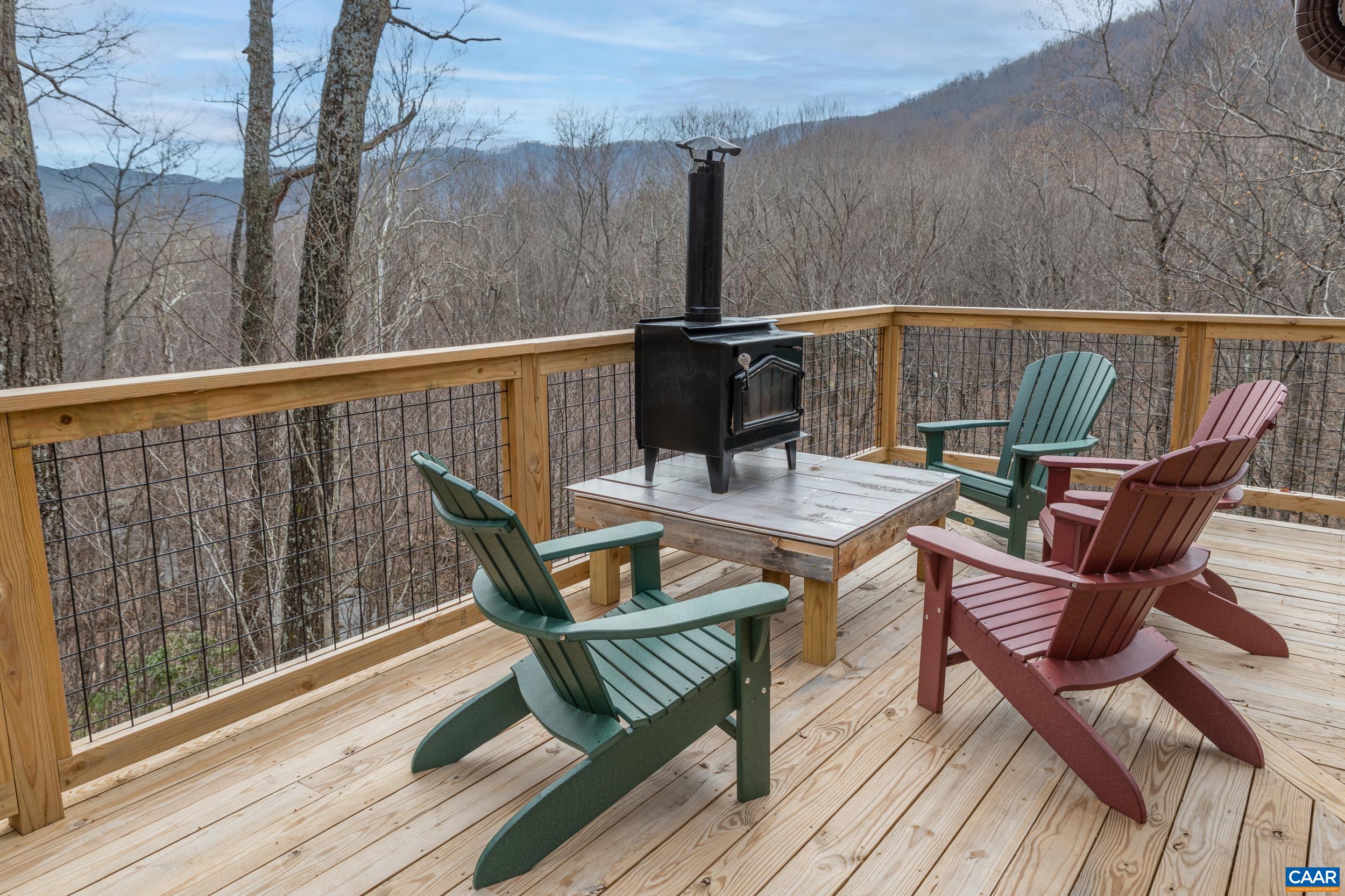 4496 Weakley Hollow Road Syria, VA 22743 - Photo 37 of 37 a view of a roof deck with wooden floor and outdoor seating