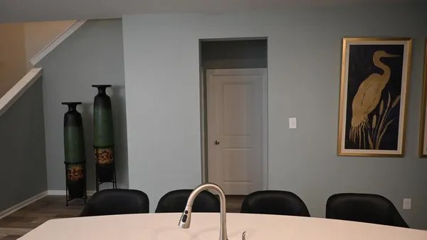 a kitchen with a sink a stove and cabinets