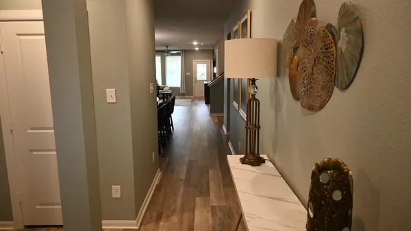 a view of hallway with furniture