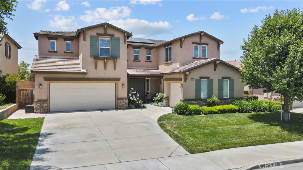 31155 Tiverton Road Menifee, CA 92584 - Photo 1 of 1 a front view of a house with a yard and potted plants