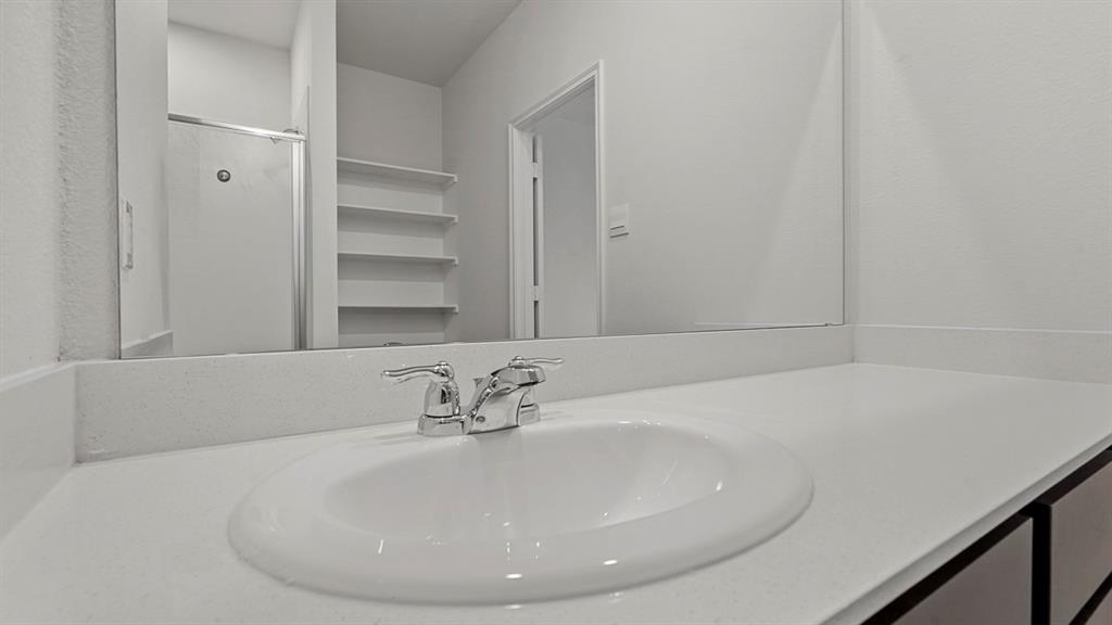 1627 Mantle Road Crandall, TX 75114 - Photo 18 of 40 Vanity with integrated sink, chrome faucet, and expansive counter space