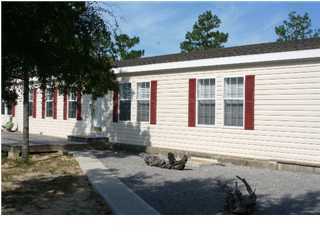 490 Long Road DeFuniak Springs, FL 32433 - Photo 1 of 22 a view of a house with a patio