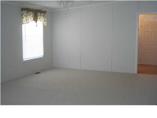 490 Long Road DeFuniak Springs, FL 32433 - Photo 17 of 22 a open area with window