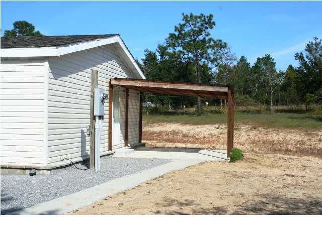 490 Long Road DeFuniak Springs, FL 32433 - Photo 7 of 22 a view of a backyard of a house