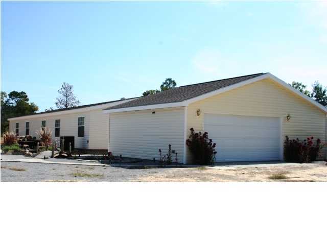 490 Long Road DeFuniak Springs, FL 32433 - Photo 9 of 22 a view of a house with a yard